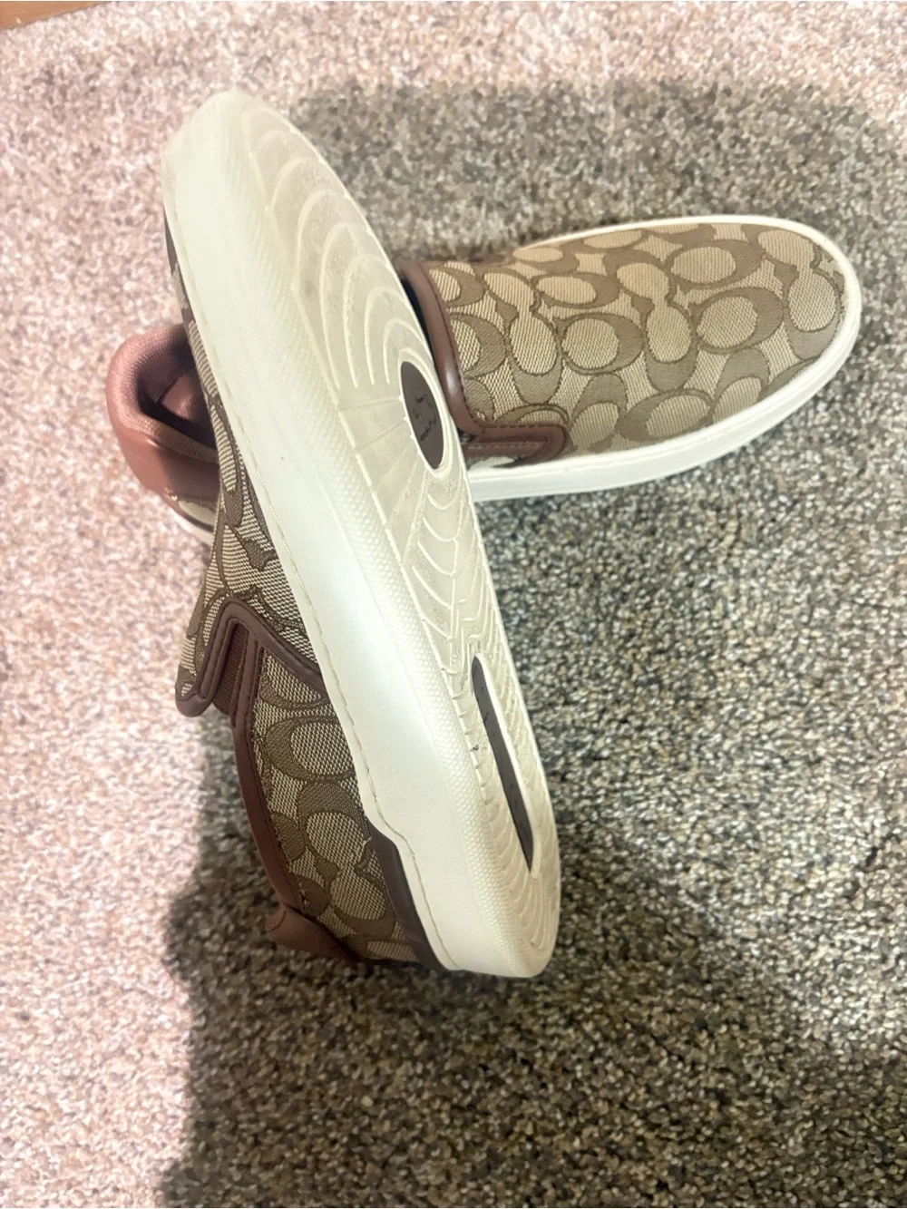 Coach women’s Brown Signature Slip-On Sneakers